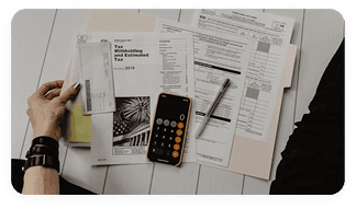 Analyst reviewing contract rates and reimbursement benchmarks