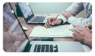 Professional reviewing initial credentialing documents on a laptop